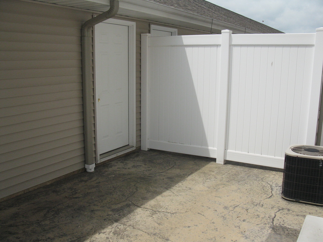 Back patio door to garage outside 300 Place Town home