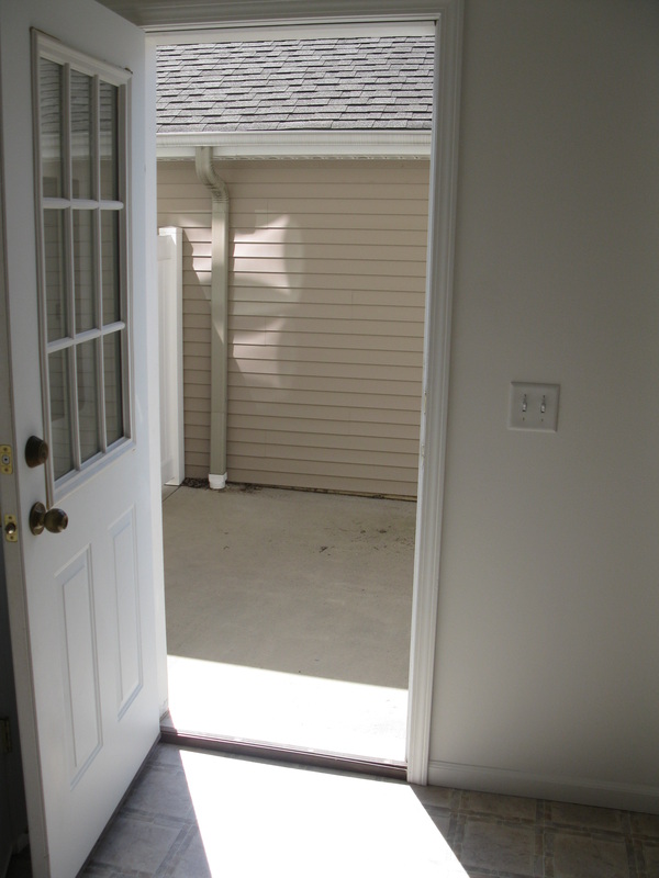 Looking out the back door towards Private patio inside of 400 Place Town home