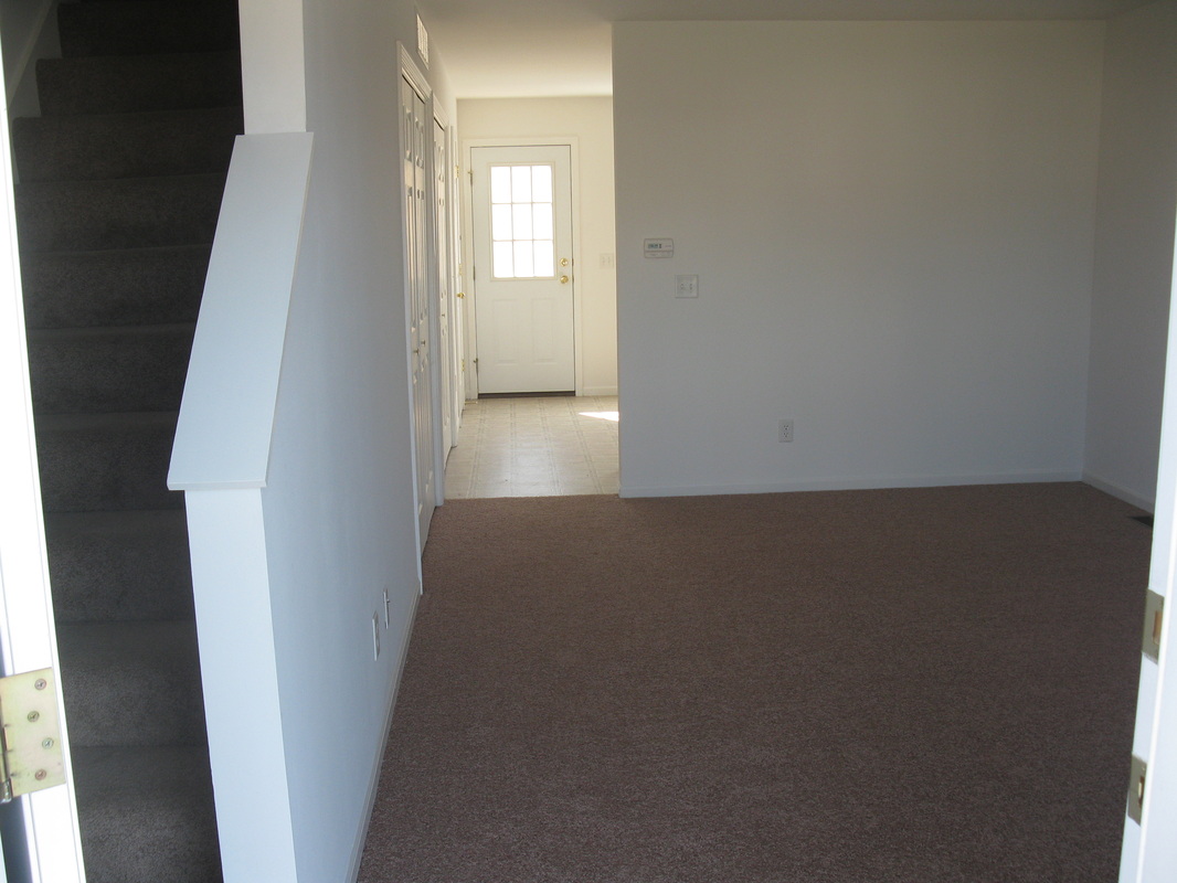 Living Room looking inside the front door in 400 Place Town home