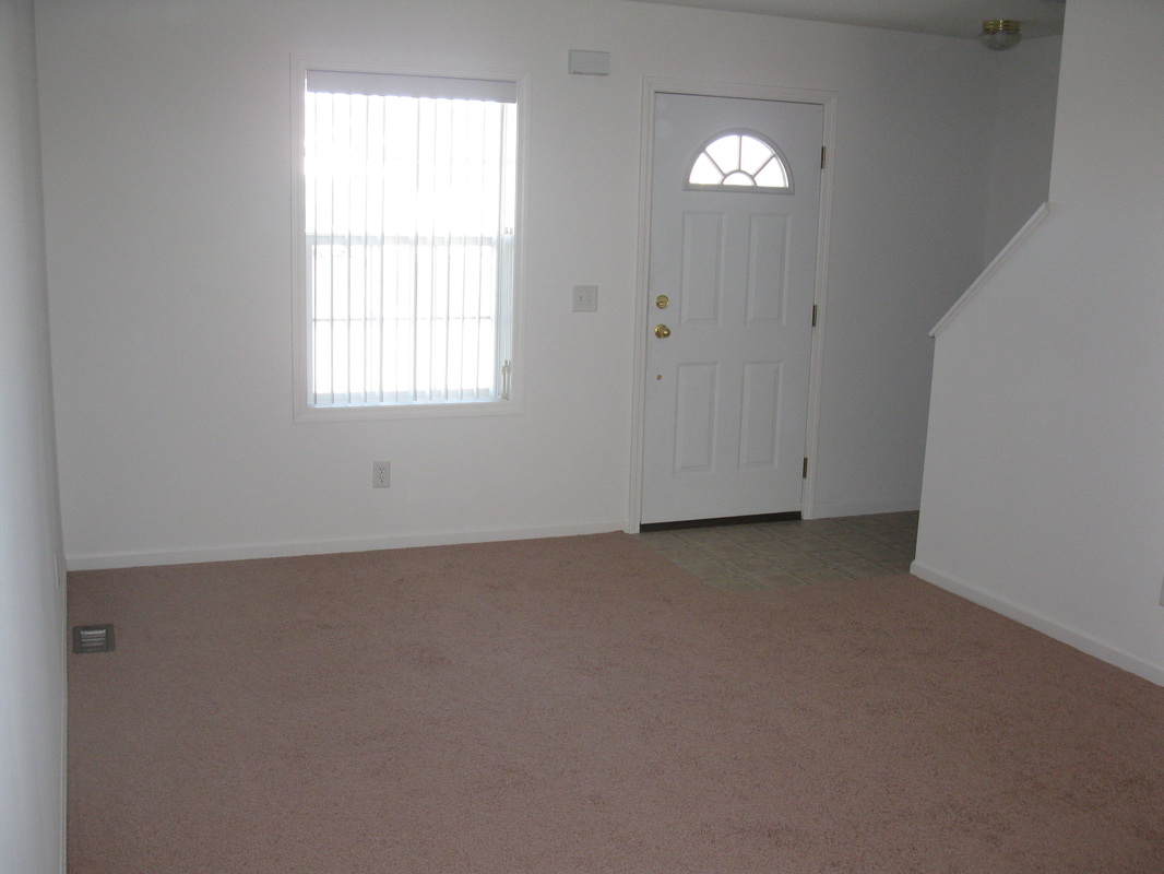 Living Room inside 400 Place Town home looking at the front door