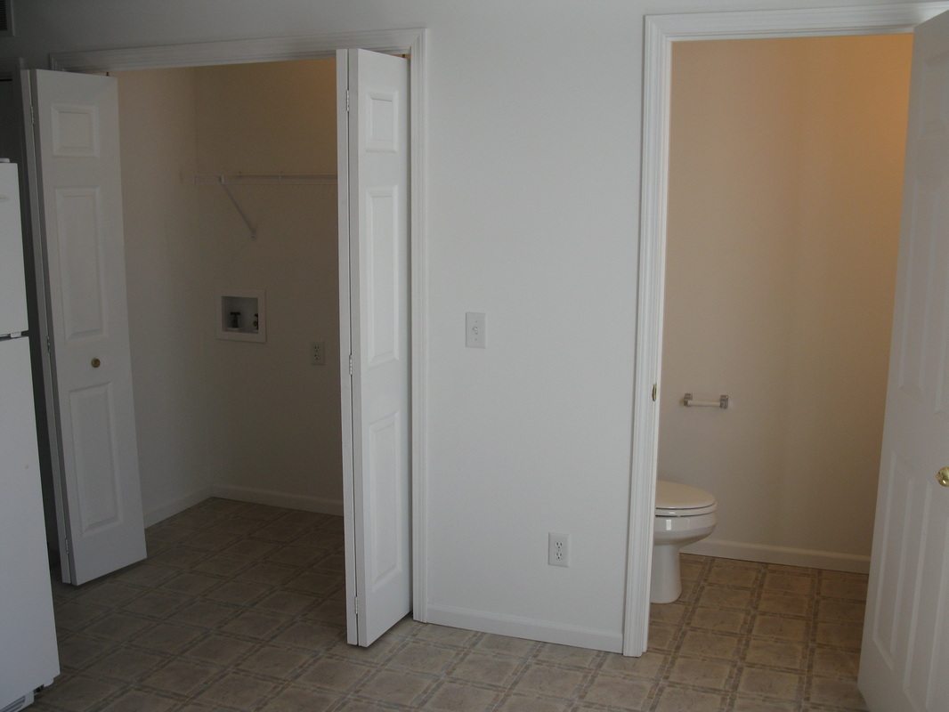 Half bathroom and laundry room in 400 Place Town home