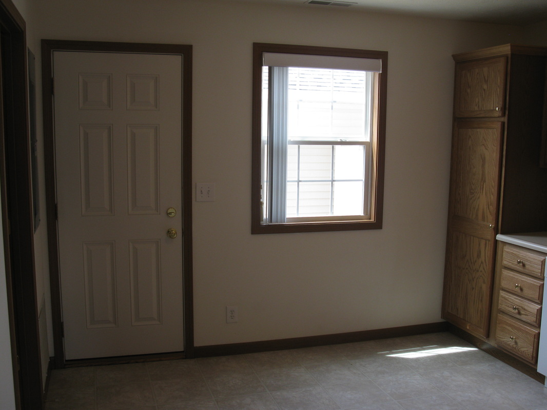 Kitchen looking at the back door to the patio in 500 Place 2 bedroom town home