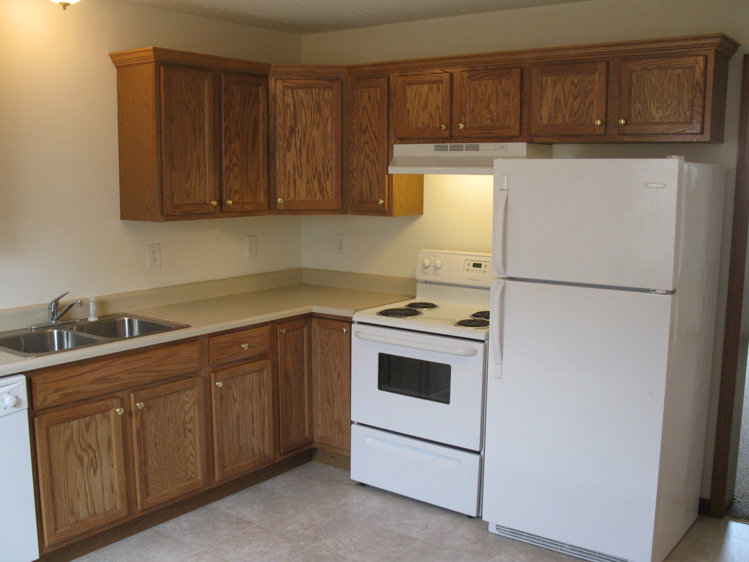 Kitchen stove oven and refrigerator in 500 Place 2 bedroom town home