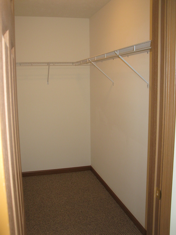 Master bedroom walk-in closet in 500 Place 3 bedroom town home