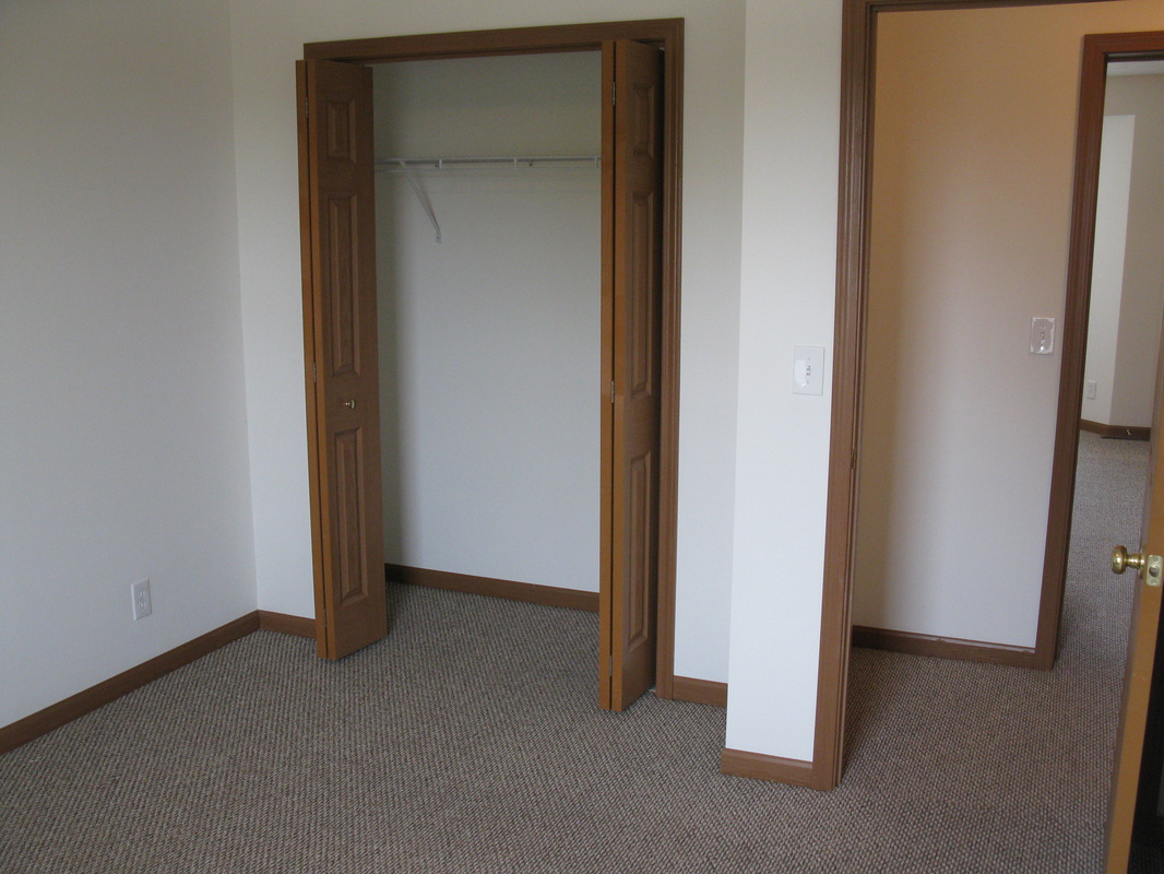 Second bedroom closet in 500 Place 3 bedroom town home