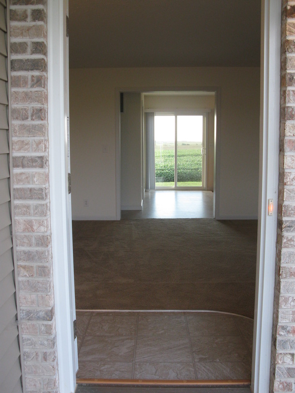 Looking in the front door at the living room of College Park Duplexes