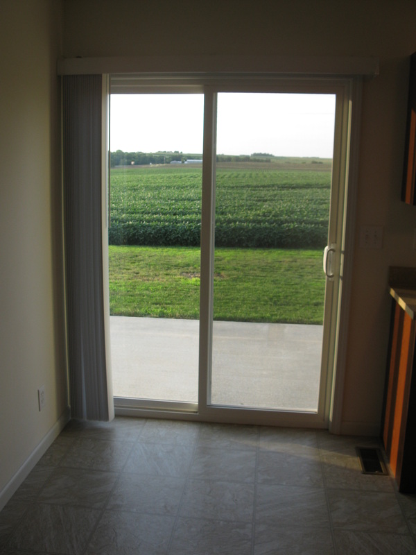 Dining area looking out back patio doors in College Park Duplex