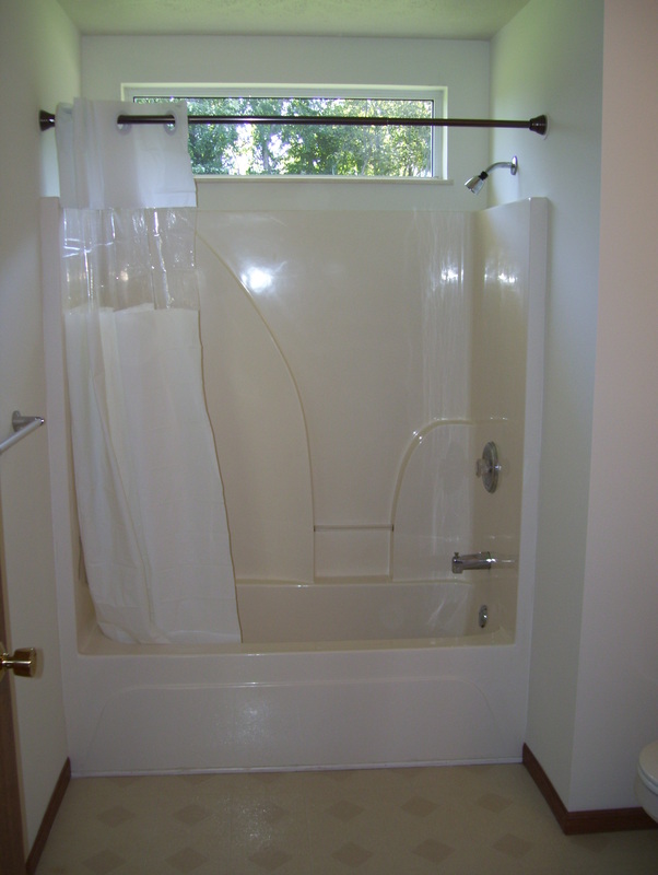 Bathroom Alcove Bathtub/Shower in First Avenue Duplex