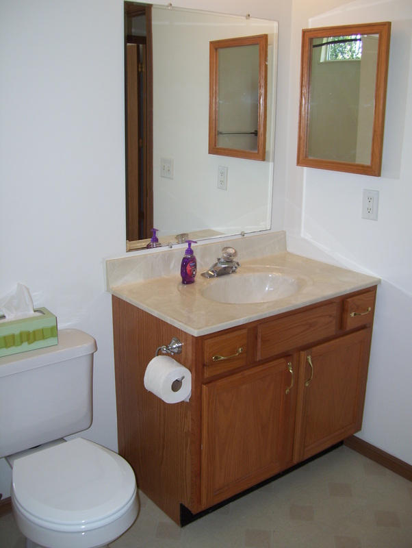 Bathroom toilet and sink in First Avenue Duplex